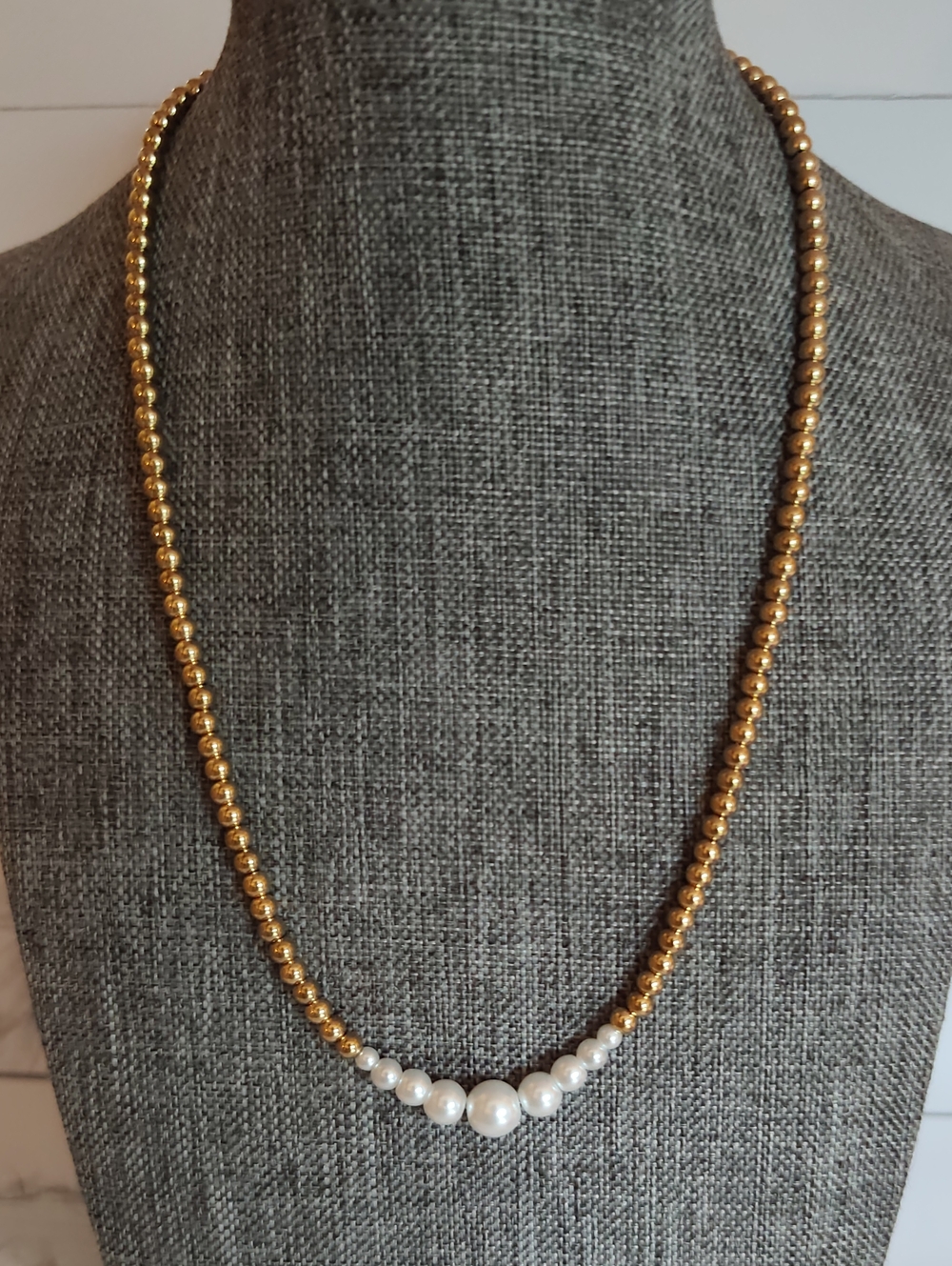 The surface is plated with a thin layer of real gold 18k. 17" Reg 19" 1/2 Ext.